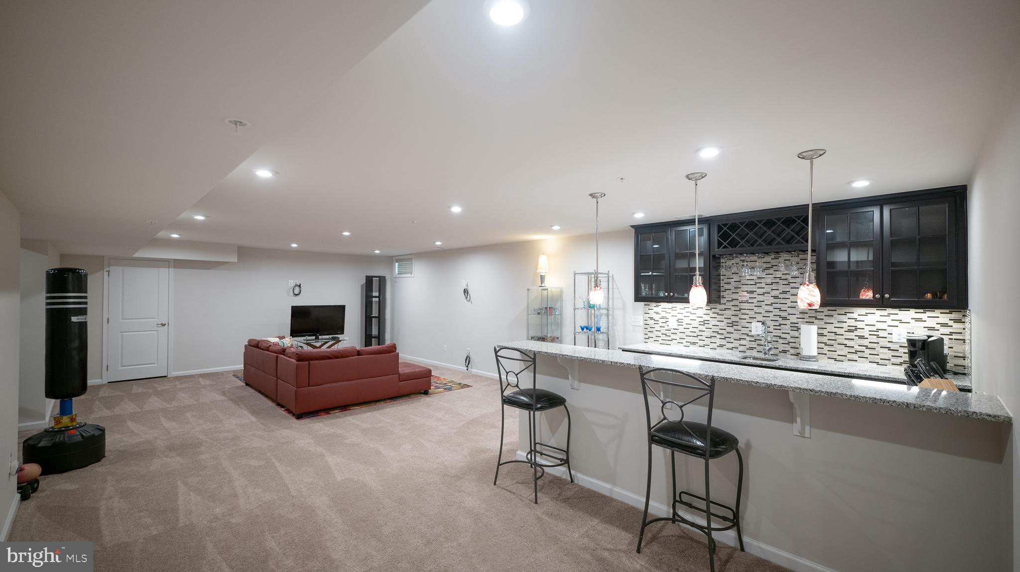14210 Jaeger Road Clarksburg, MD 20871 - Photo 22 of 29 Basement Rec-room with fully equipped wet bar