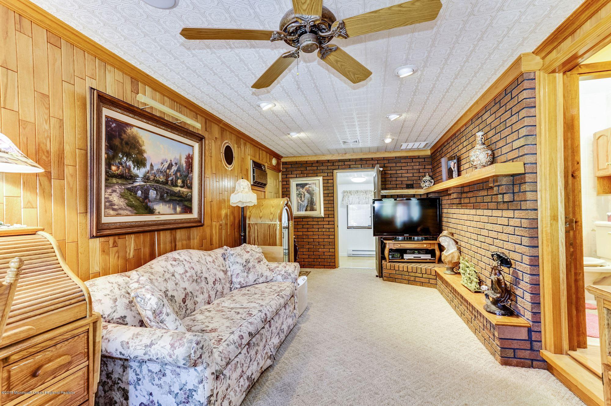 9 Kenmore Road Freehold, NJ 07728 - Photo 12 of 25 a bedroom with furniture and a flat screen tv