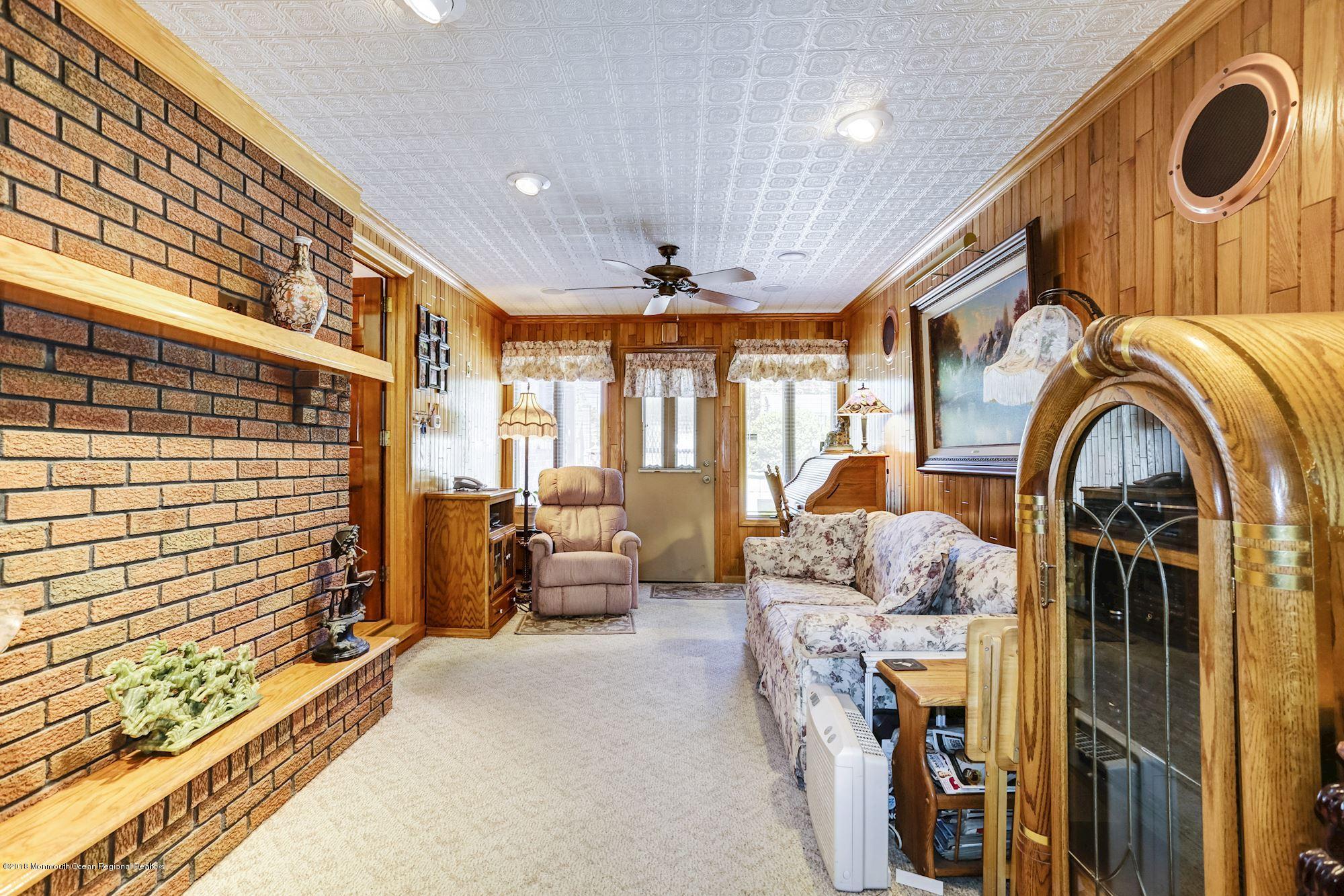9 Kenmore Road Freehold, NJ 07728 - Photo 13 of 25 a living room with furniture and a large window
