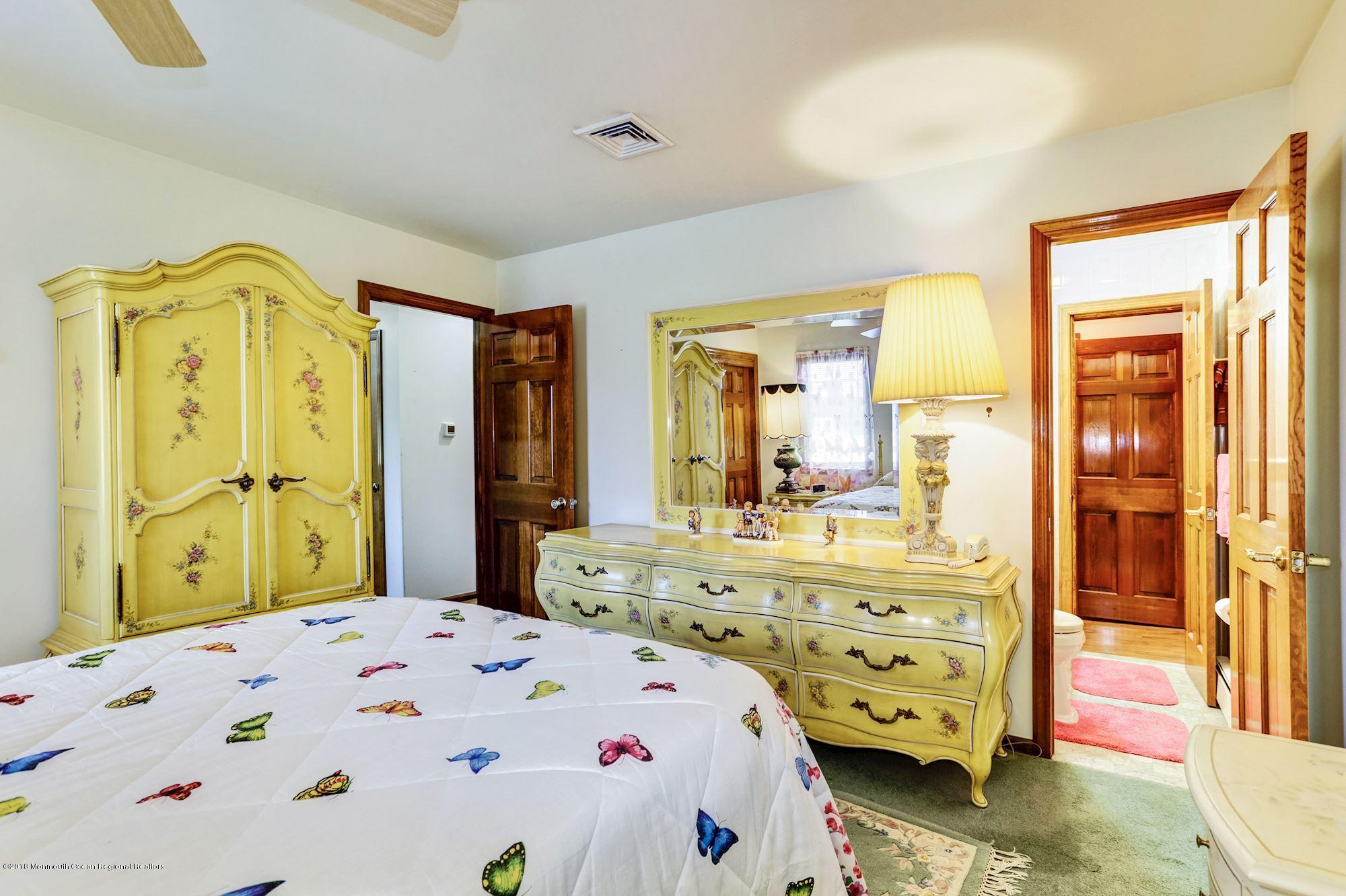 9 Kenmore Road Freehold, NJ 07728 - Photo 15 of 25 a bedroom with a bed and a dresser