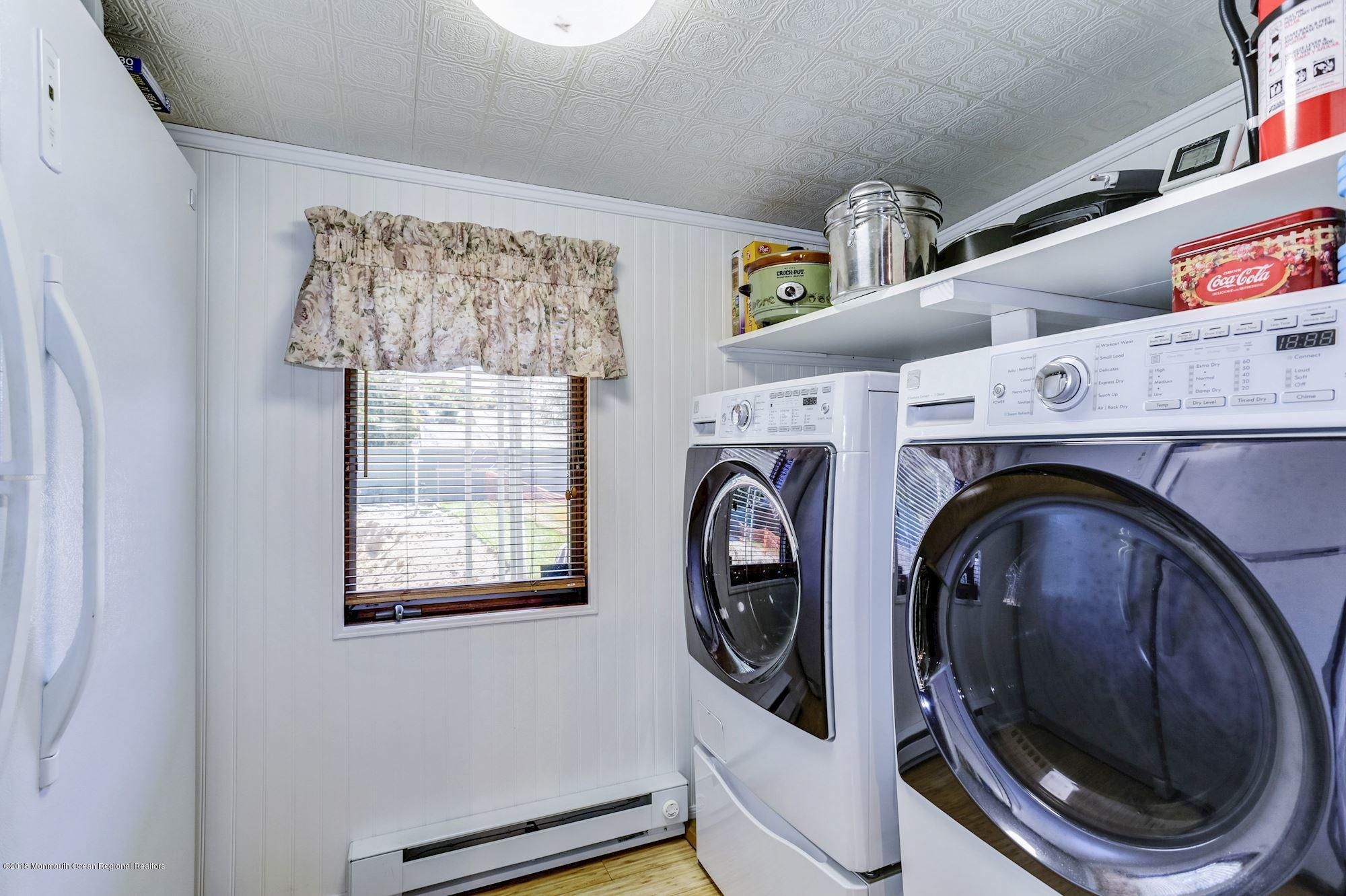 9 Kenmore Road Freehold, NJ 07728 - Photo 18 of 25 a utility room with dryer and washer