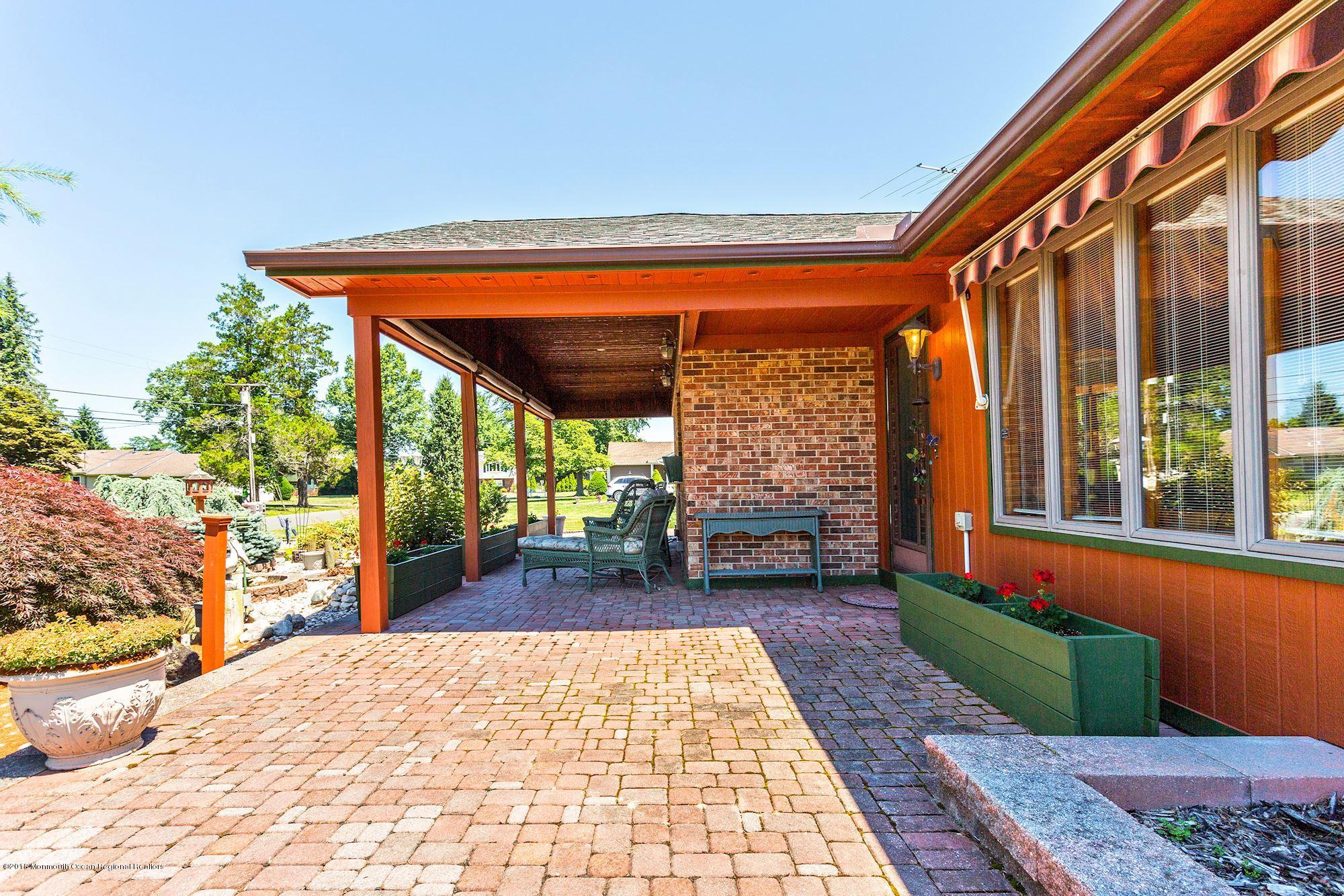 9 Kenmore Road Freehold, NJ 07728 - Photo 3 of 25 a front view of a house with a porch