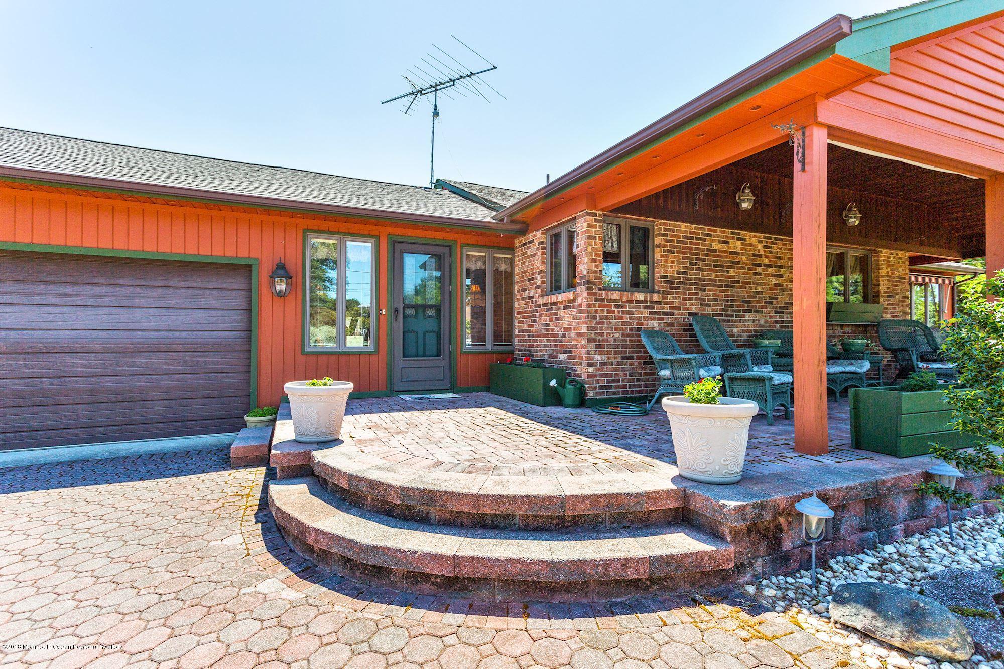 9 Kenmore Road Freehold, NJ 07728 - Photo 4 of 25 a view of a house with porch and sitting area