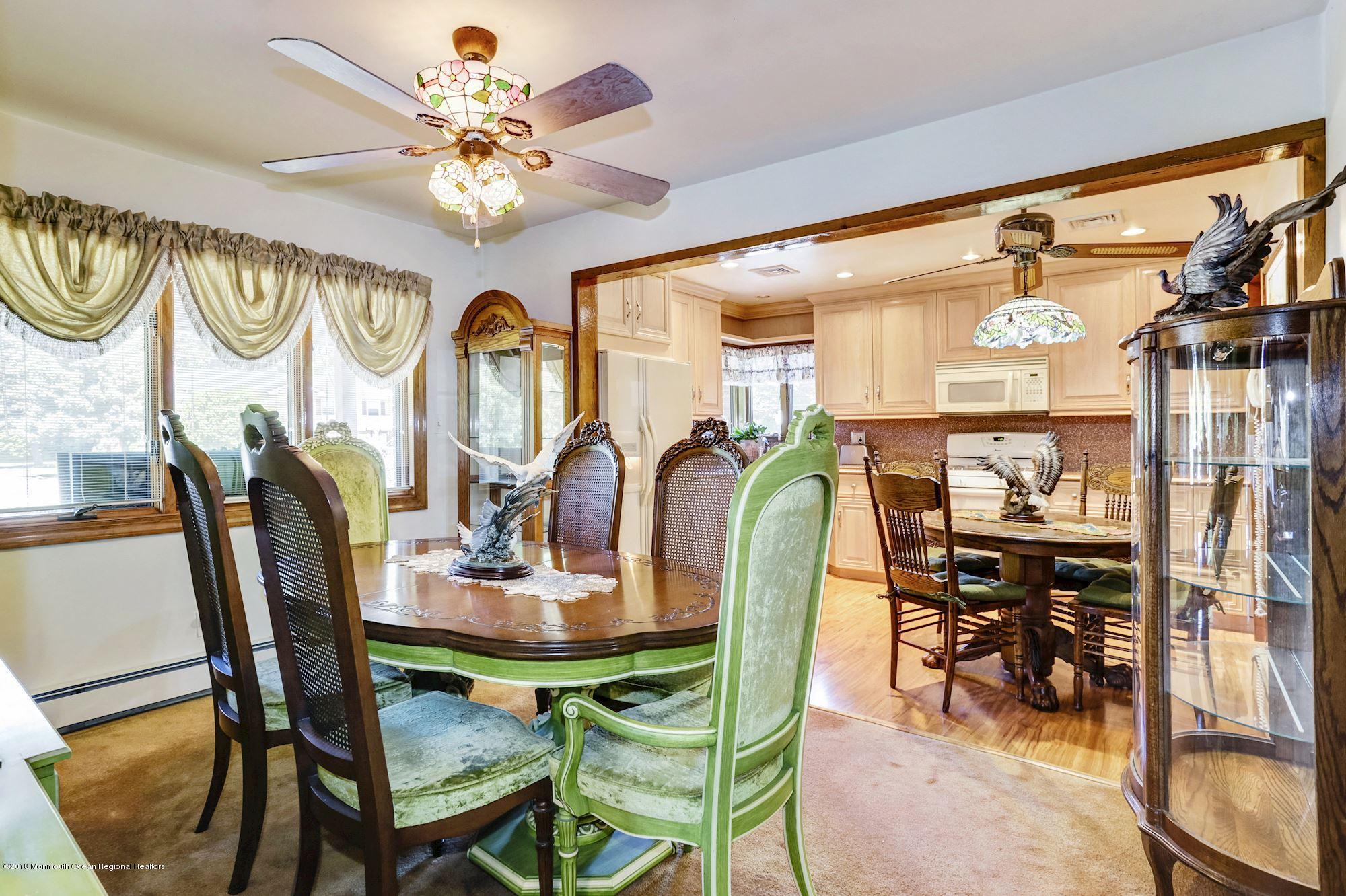 9 Kenmore Road Freehold, NJ 07728 - Photo 7 of 25 a view of a dining room with furniture and chandelier