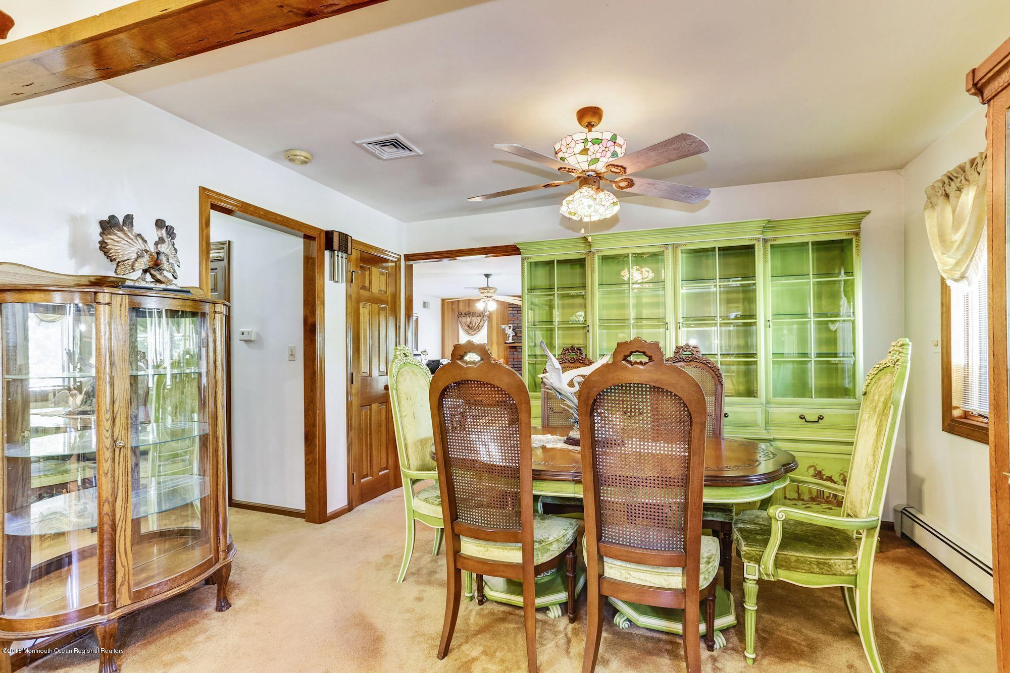 9 Kenmore Road Freehold, NJ 07728 - Photo 8 of 25 a dining room with furniture and chandelier fan