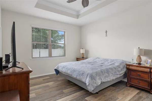 a bedroom with a bed and dresser