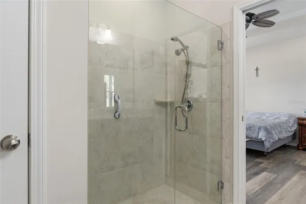 a bathroom with a granite countertop toilet sink and shower