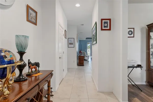 a view of workspace with furniture and paintings on the wall