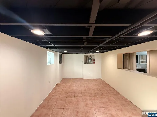 a view of hallway with wooden floor