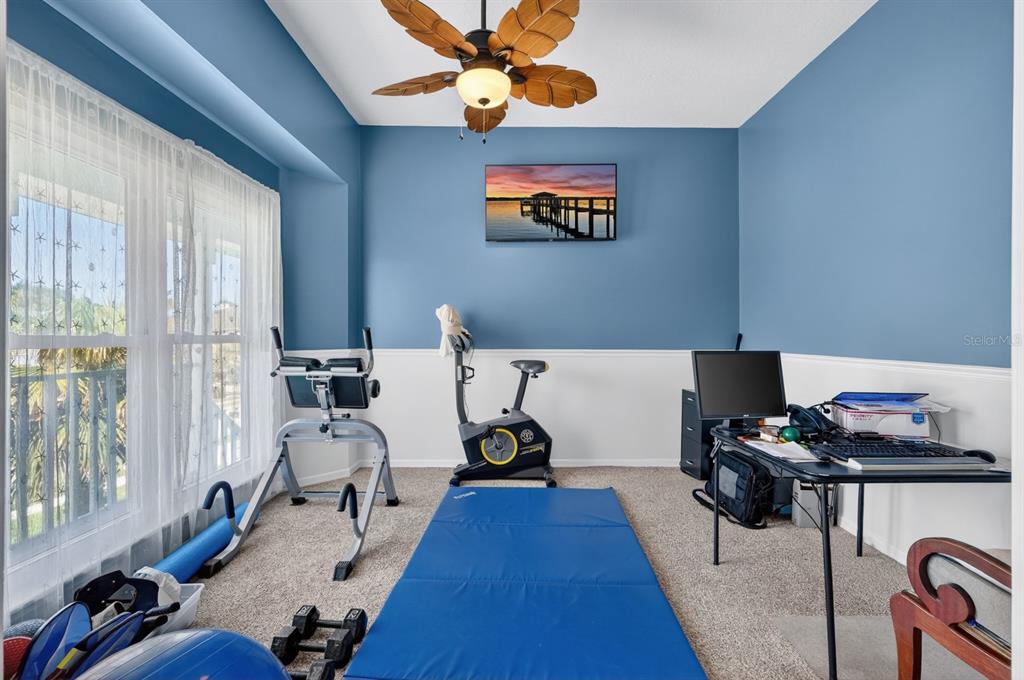 49 Loggerhead Court Ponce Inlet, FL 32127 - Photo 24 of 59 a bedroom with bed and glass windows