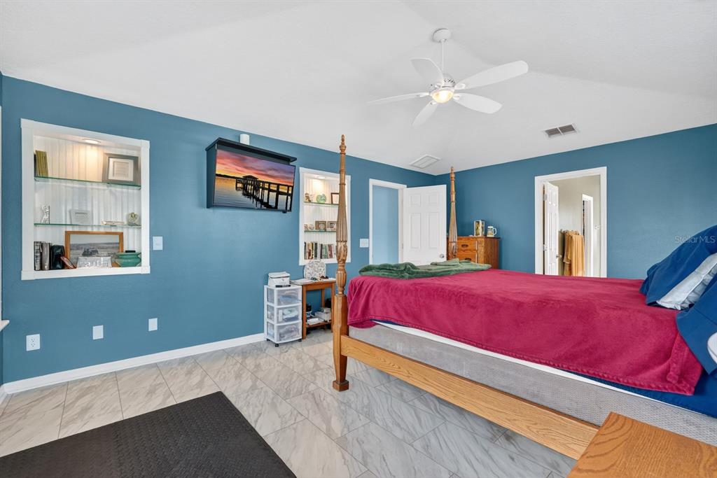 49 Loggerhead Court Ponce Inlet, FL 32127 - Photo 26 of 59 a bedroom with bed and window