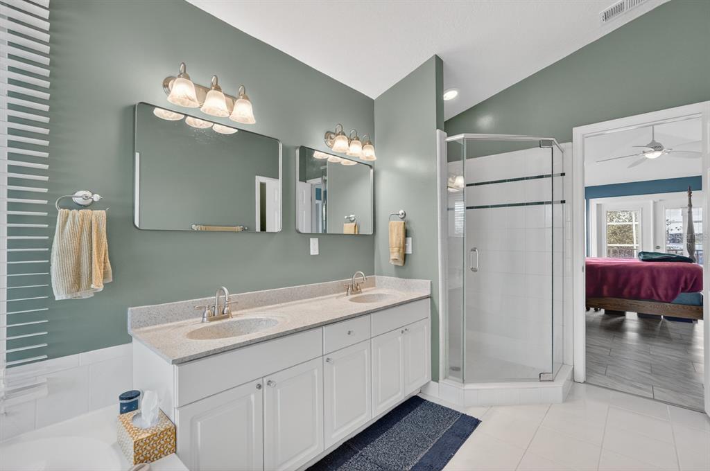 49 Loggerhead Court Ponce Inlet, FL 32127 - Photo 27 of 59 a bathroom with a sink double vanity and a mirror