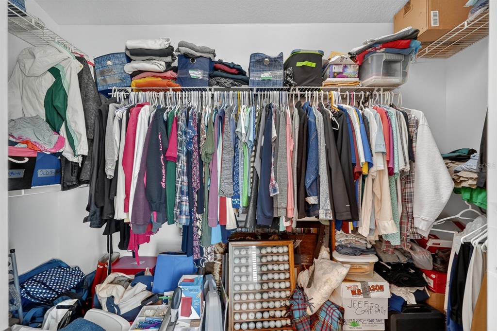 49 Loggerhead Court Ponce Inlet, FL 32127 - Photo 29 of 59 a view of walk in closet with clothes and shoes