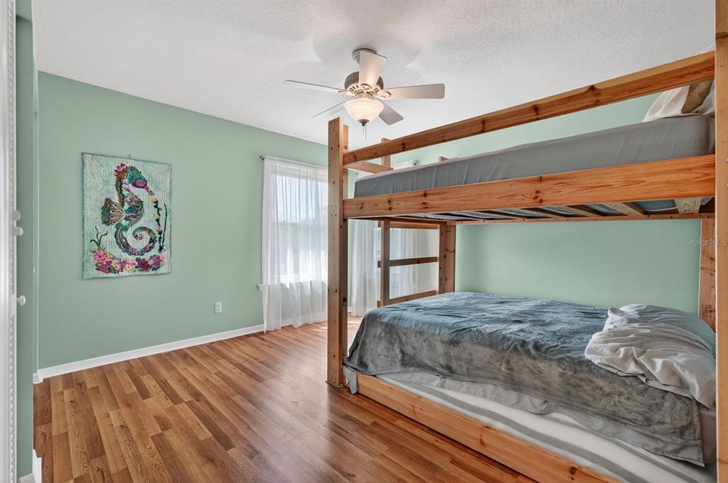 49 Loggerhead Court Ponce Inlet, FL 32127 - Photo 30 of 59 a bedroom with a bed and a window