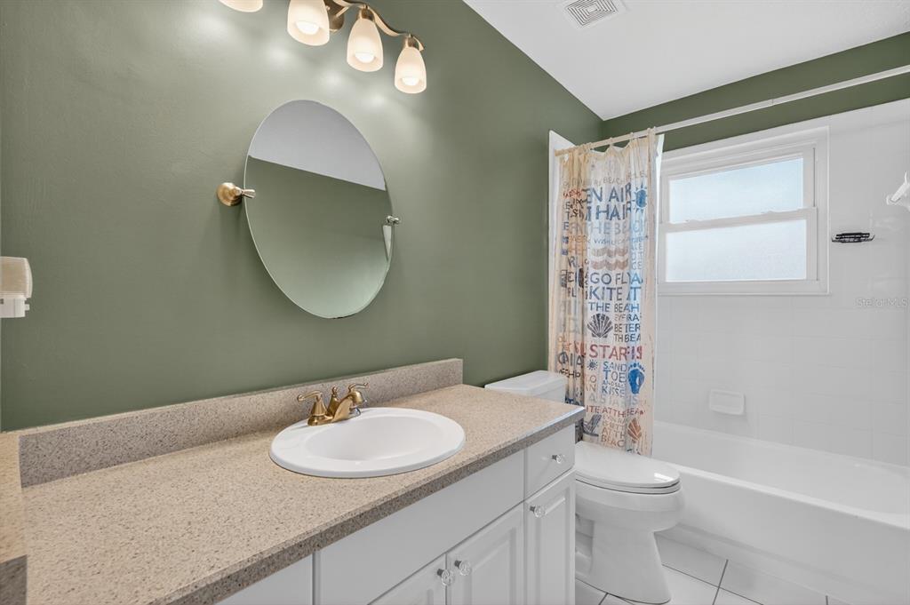 49 Loggerhead Court Ponce Inlet, FL 32127 - Photo 32 of 59 a bathroom with a sink toilet and shower