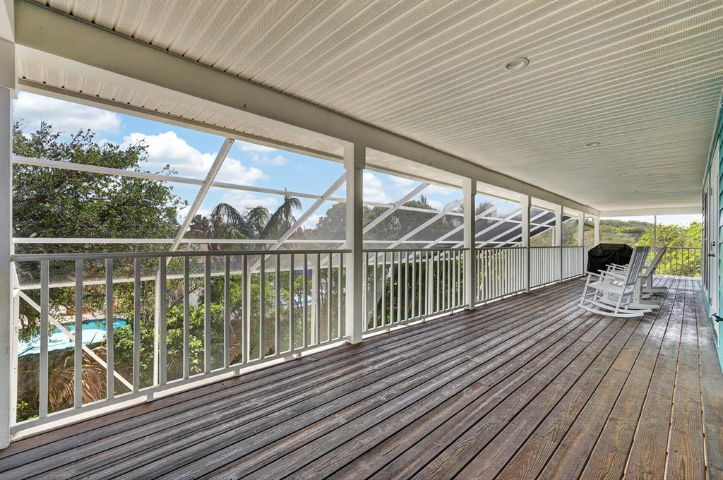 49 Loggerhead Court Ponce Inlet, FL 32127 - Photo 37 of 59 a view of a balcony with wooden floor