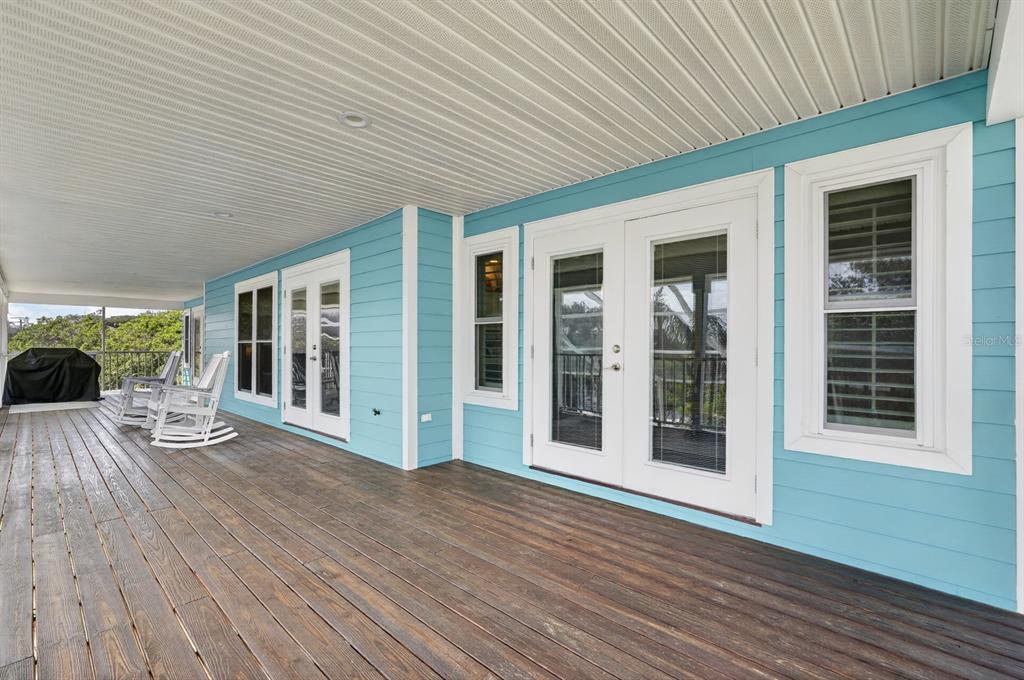 49 Loggerhead Court Ponce Inlet, FL 32127 - Photo 38 of 59 a view of a house with wooden floor and floor to ceiling window