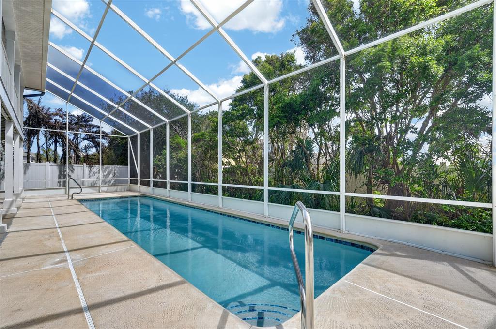 49 Loggerhead Court Ponce Inlet, FL 32127 - Photo 40 of 59 a view of a swimming pool with a patio