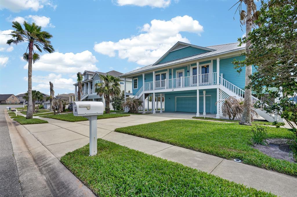 49 Loggerhead Court Ponce Inlet, FL 32127 - Photo 59 of 59 a front view of a house with a yard and potted plants