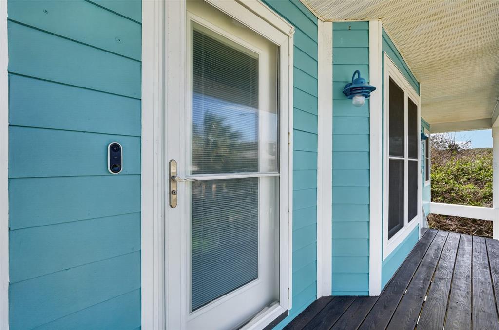49 Loggerhead Court Ponce Inlet, FL 32127 - Photo 7 of 59 a view of a balcony with wooden floor and brick wall