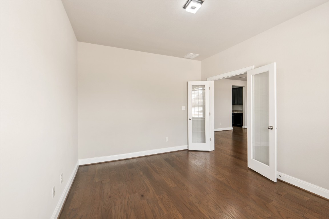2260 Hat Bender Loop Round Rock, TX 78664 - Photo 13 of 40 a view of an empty room with wooden floor