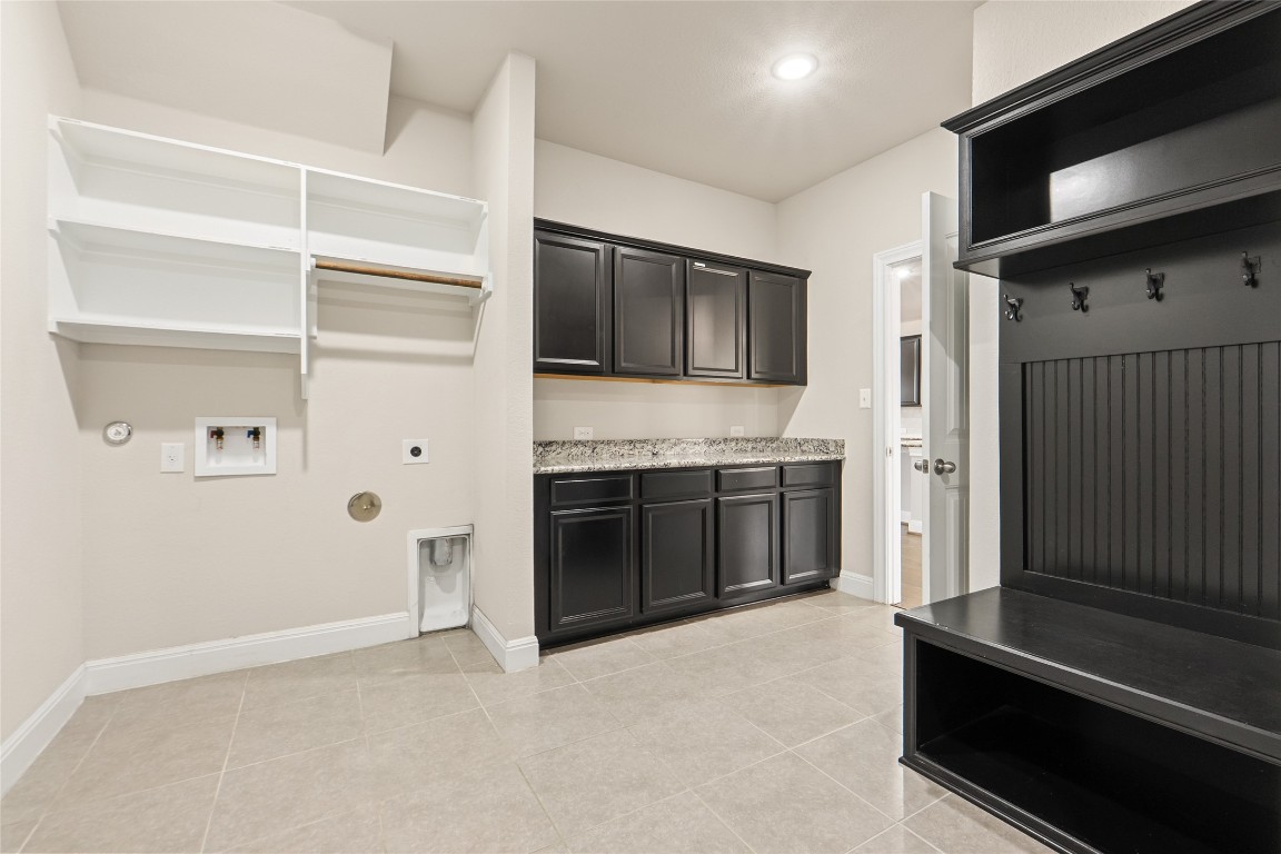 2260 Hat Bender Loop Round Rock, TX 78664 - Photo 16 of 40 a open kitchen with a stove and a refrigerator