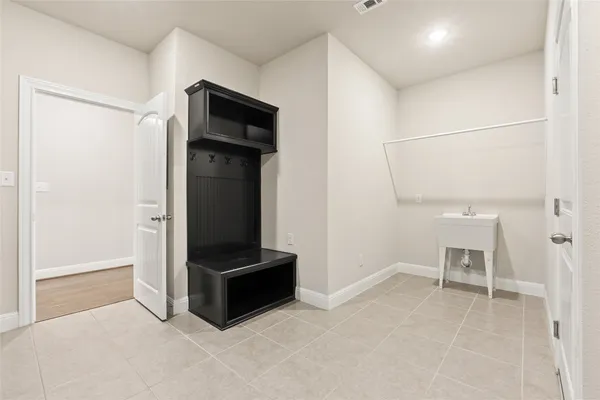 a view of room with furniture and refrigerator