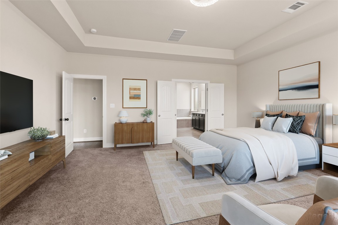2260 Hat Bender Loop Round Rock, TX 78664 - Photo 19 of 40 a spacious bedroom with a bed and a couch