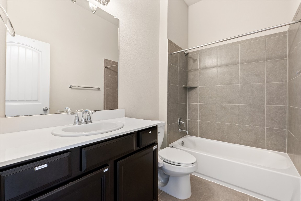 2260 Hat Bender Loop Round Rock, TX 78664 - Photo 23 of 40 a bathroom with a sink a toilet and shower
