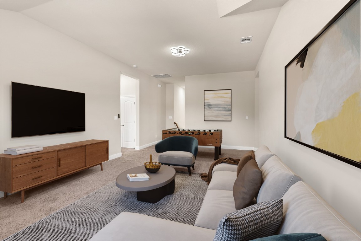 2260 Hat Bender Loop Round Rock, TX 78664 - Photo 24 of 40 a living room with furniture and a flat screen tv
