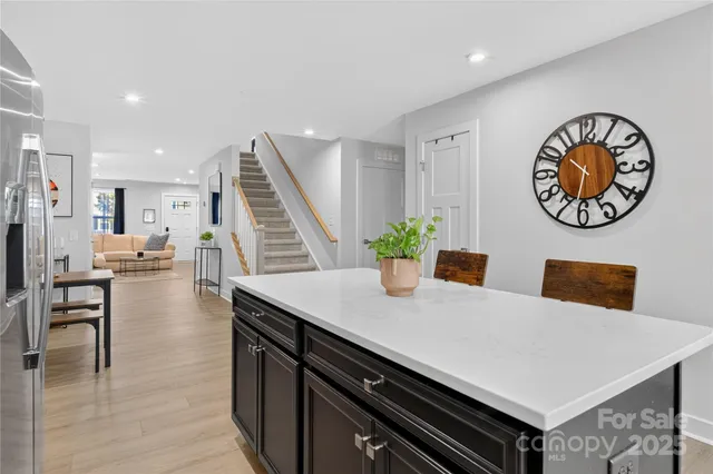 a kitchen with a table and chairs