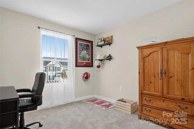 a bedroom with a workspace