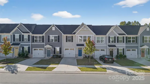 a view of multiple houses with a yard