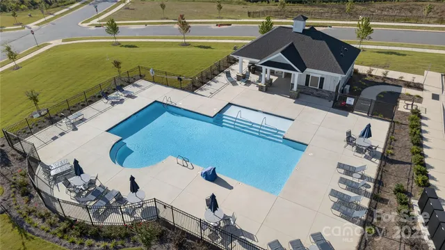an aerial view of a house with a ocean view