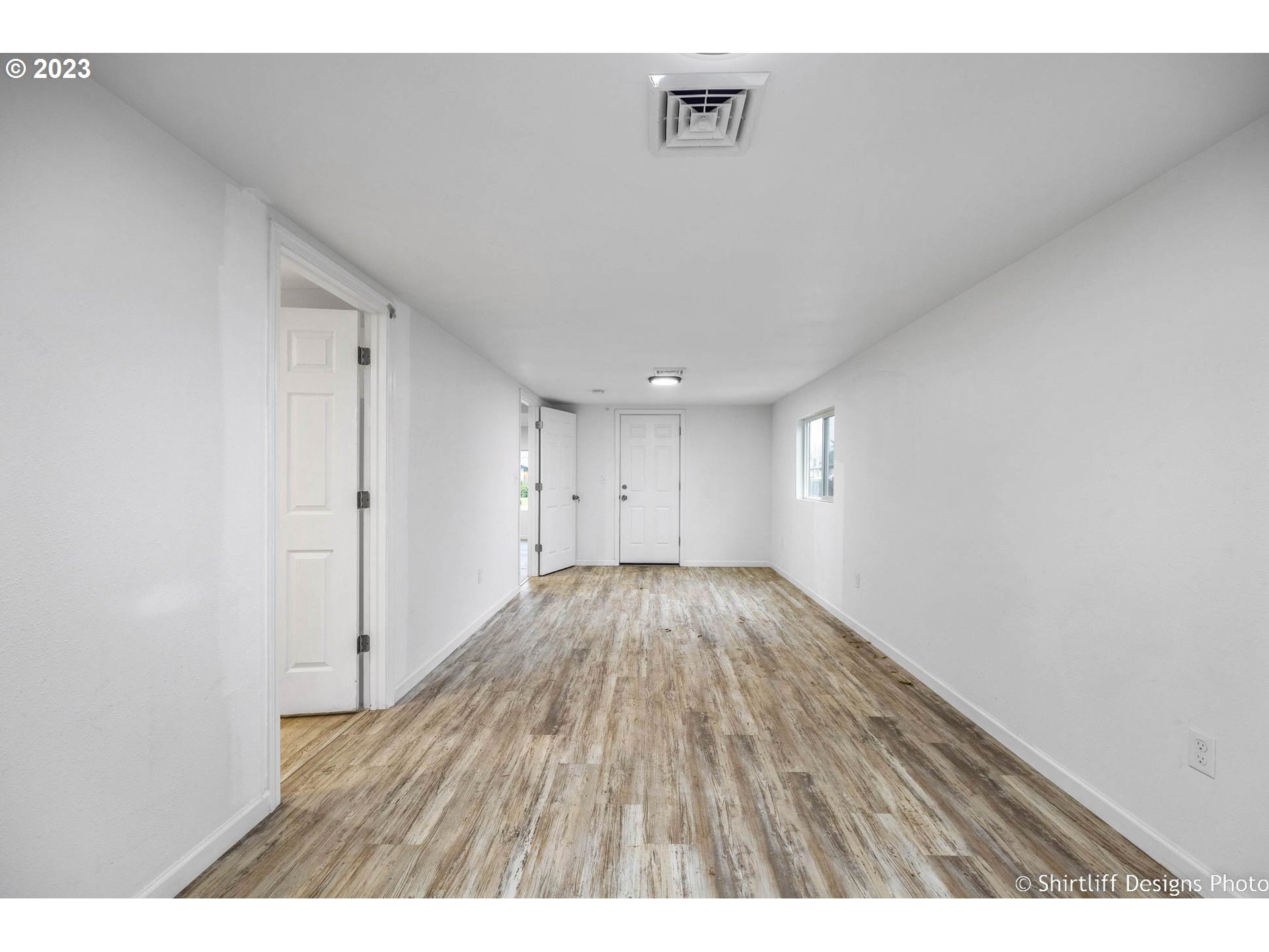 735 West M Street Springfield, OR 97477 - Photo 15 of 29 a view of an empty room and wooden floor