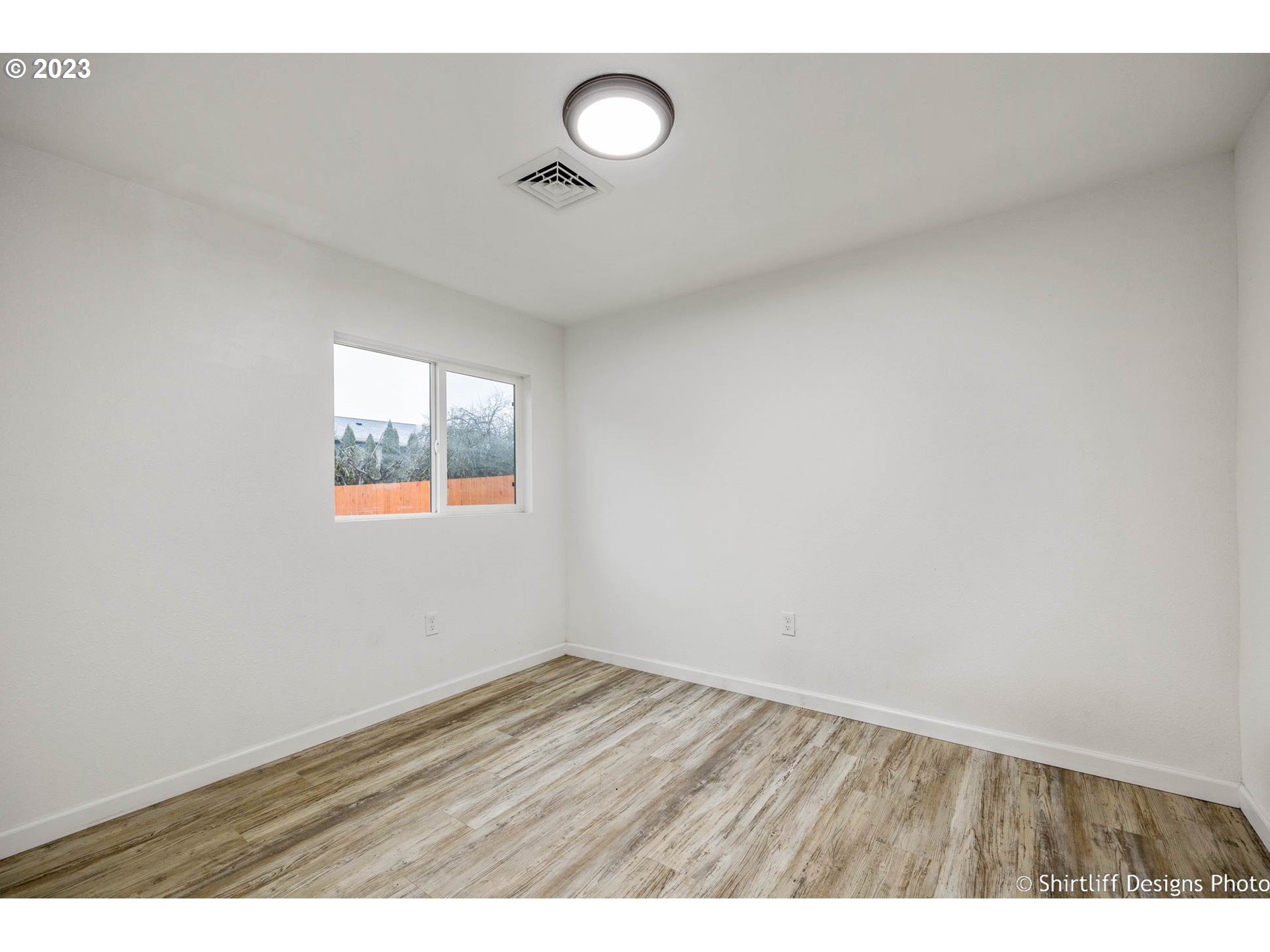 735 West M Street Springfield, OR 97477 - Photo 18 of 29 a view of an empty room with a window