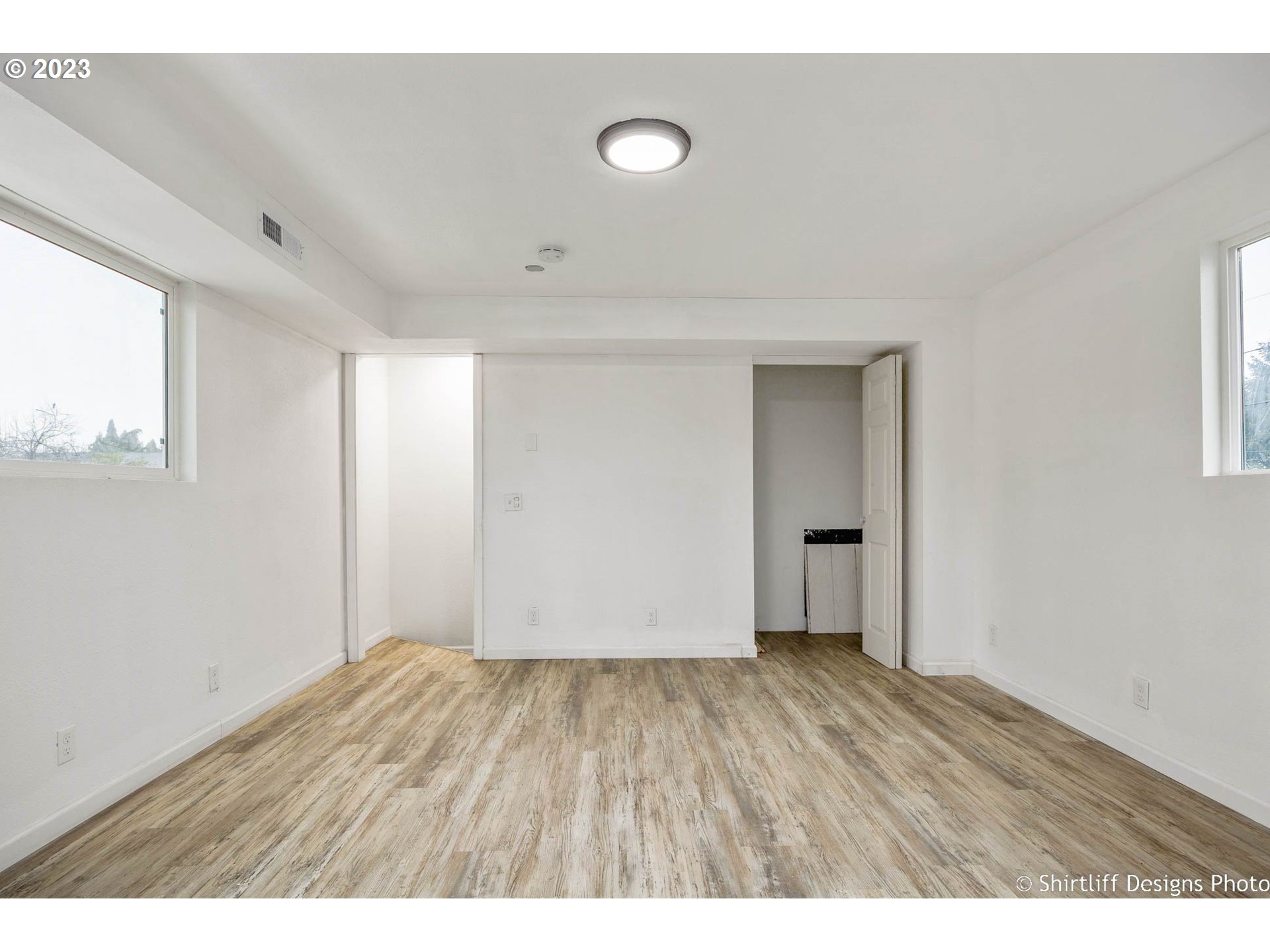 735 West M Street Springfield, OR 97477 - Photo 26 of 29 a view of an empty room with wooden floor