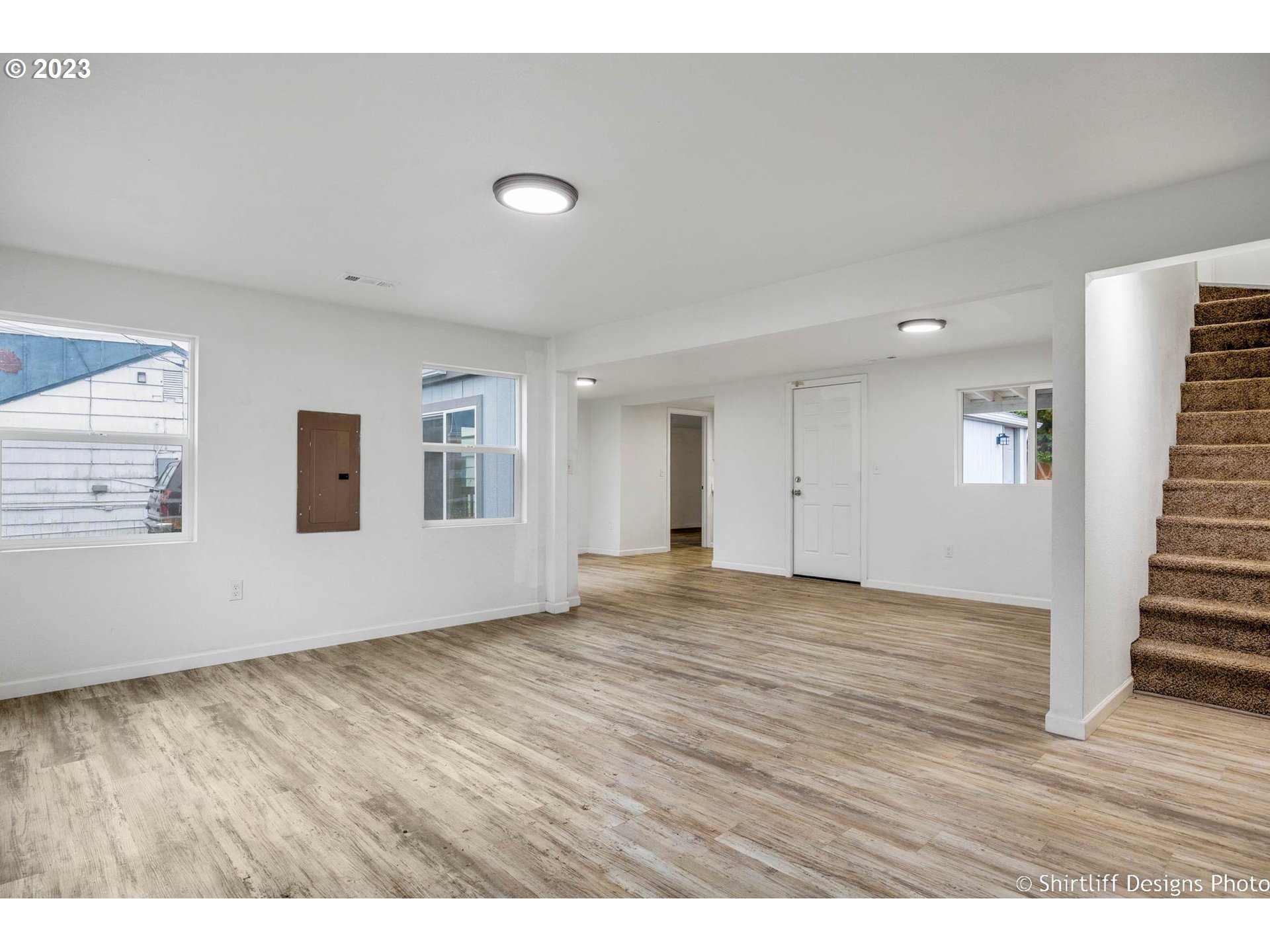 735 West M Street Springfield, OR 97477 - Photo 5 of 29 a view of an empty room with wooden floor and a window