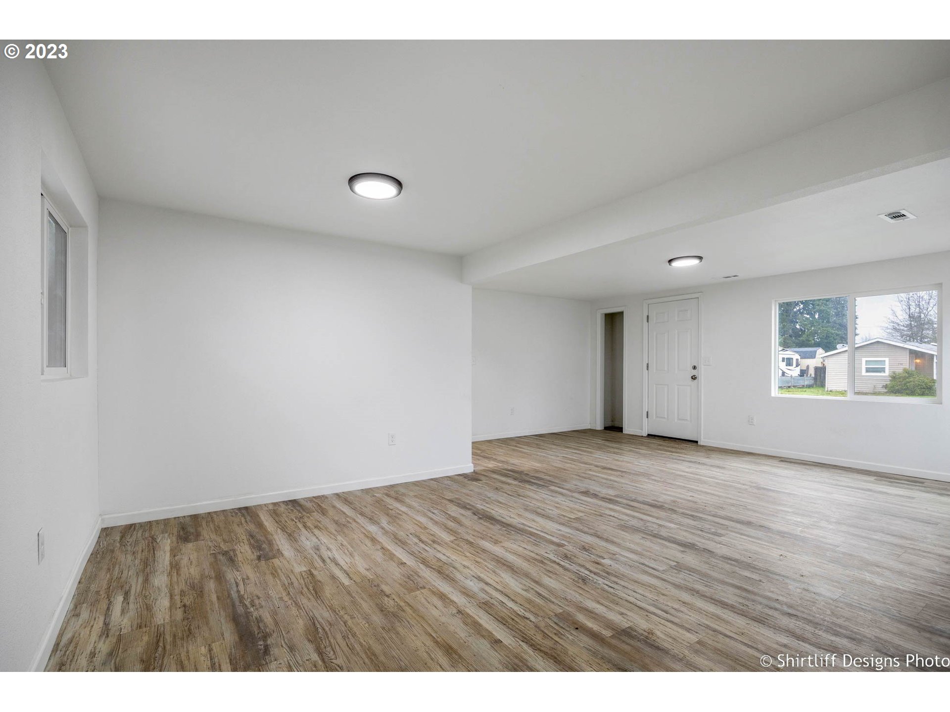 735 West M Street Springfield, OR 97477 - Photo 7 of 29 a view of an empty room and wooden floor