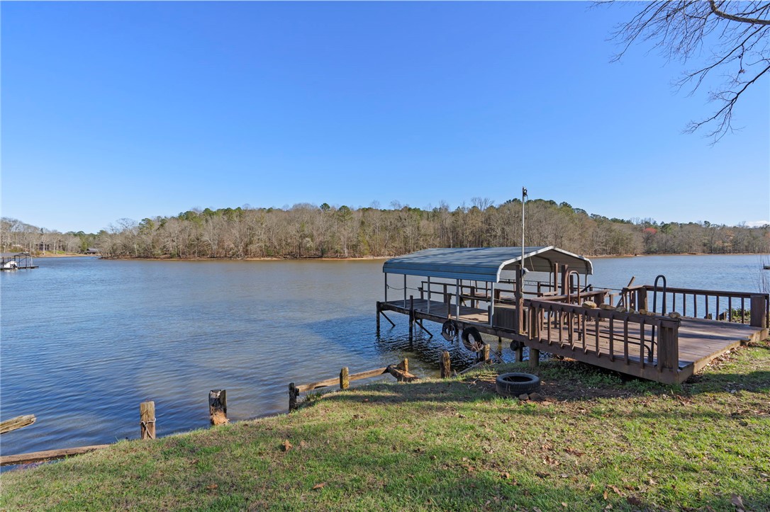 122 Latham Drive Anderson, SC 29621 - Photo 29 of 40 Enjoy direct lake access with this private boat dock, offering endless waterfront possibilities.