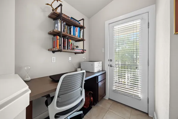 a utility room with washing machine