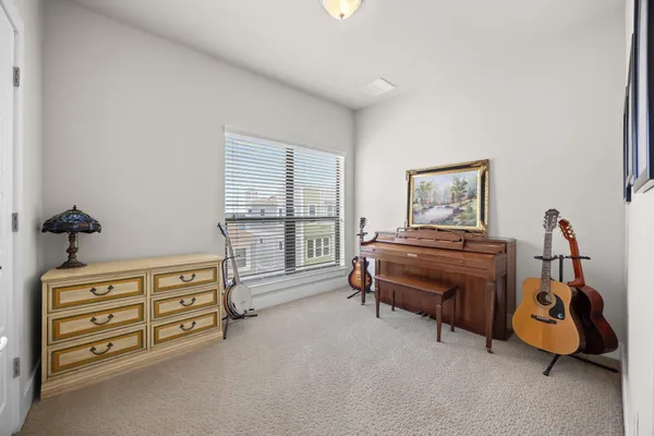 a bathroom with a sink a toilet a large mirror and shower