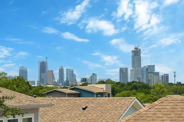 a view of a swimming pool and lounge chairs