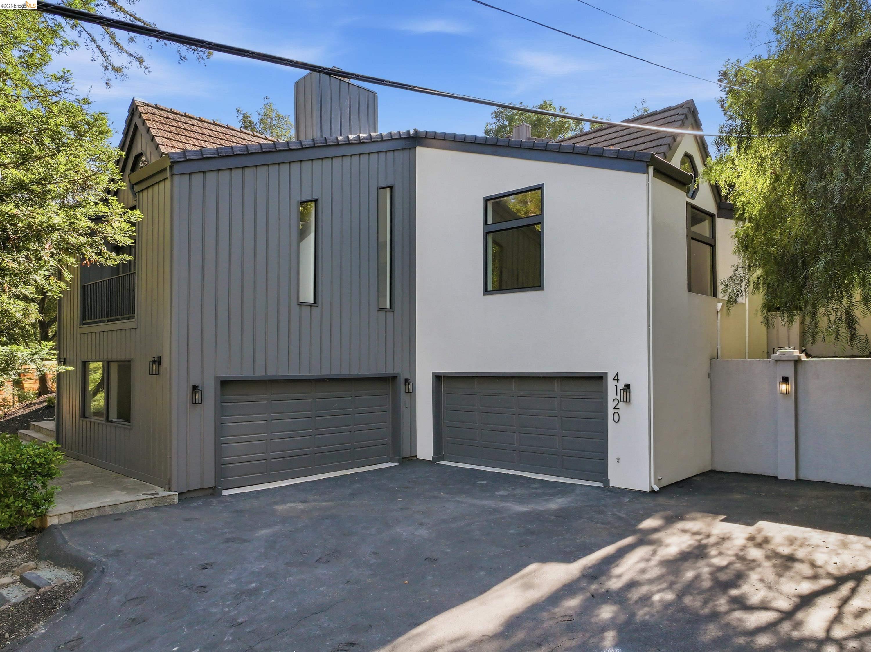 4120 Happy Valley Road Lafayette, CA 94549 - Photo 29 of 33 Modern architectural exterior featuring vertical panel siding and smooth stucco finishes