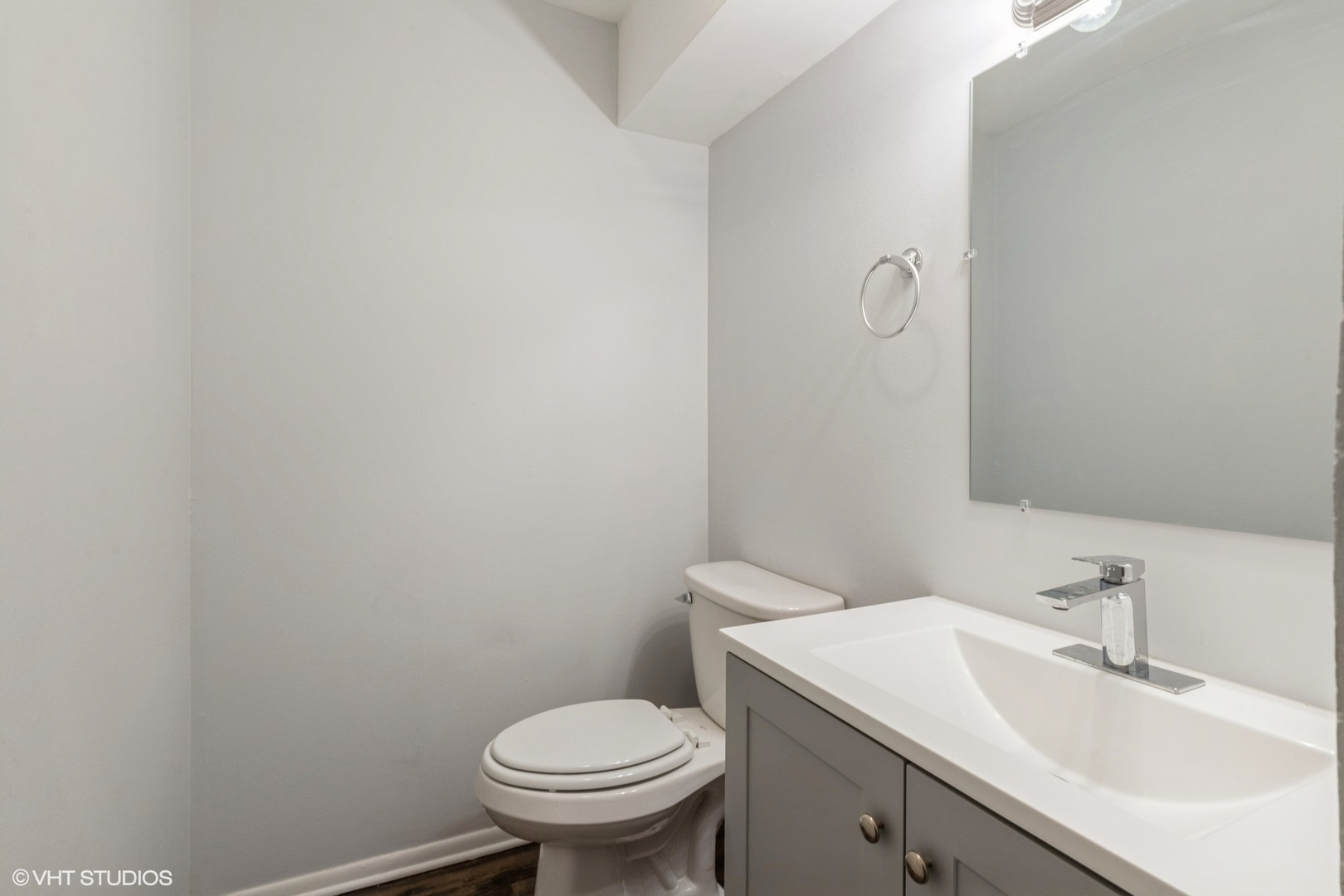 9349 Dee Road Des Plaines, IL 60016 - Photo 20 of 22 a bathroom with a sink and a toilet