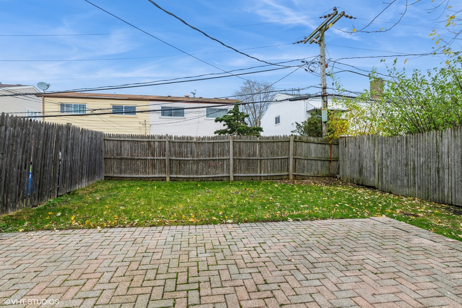 9349 Dee Road Des Plaines, IL 60016 - Photo 22 of 22 a view of a backyard with wooden fence
