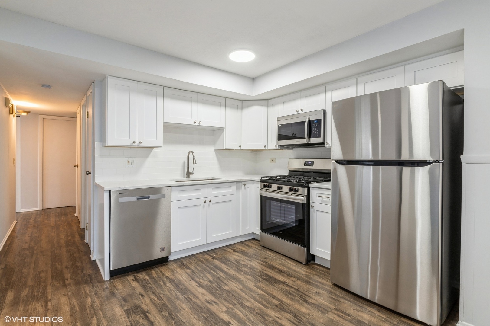9349 Dee Road Des Plaines, IL 60016 - Photo 4 of 22 a kitchen with a refrigerator stove and microwave