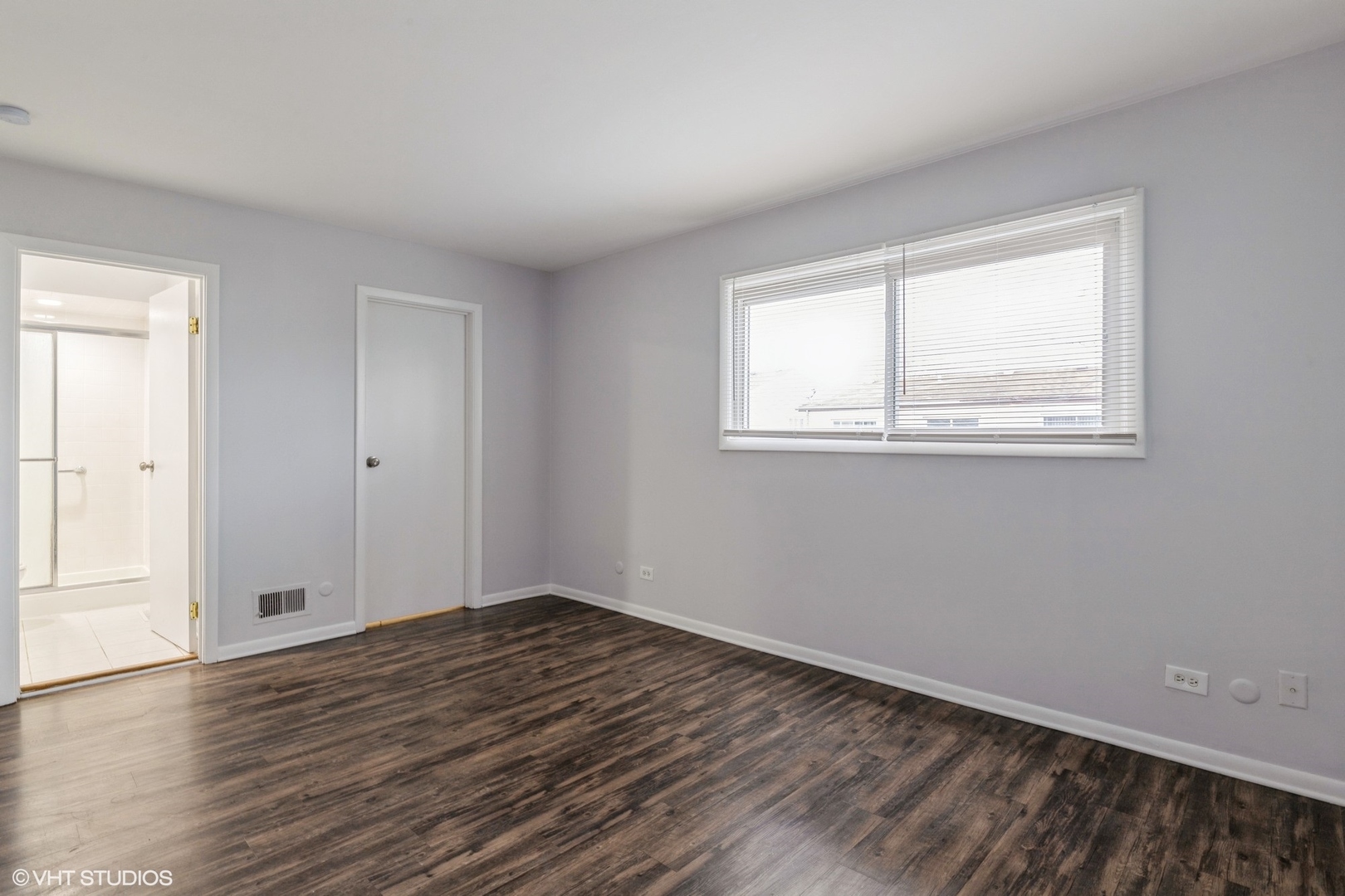9349 Dee Road Des Plaines, IL 60016 - Photo 8 of 22 a view of empty room with wooden floor and fan