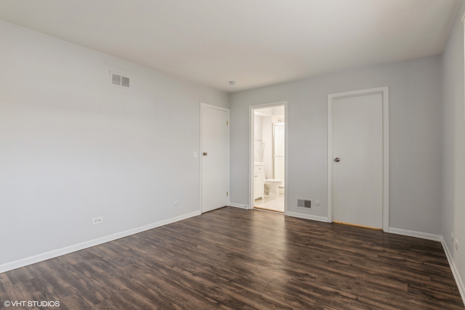 9349 Dee Road Des Plaines, IL 60016 - Photo 9 of 22 a view of an empty room with wooden floor