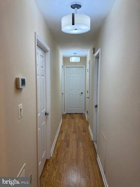 3822 Bel Pre Road, Unit 38223 Silver Spring, MD 20906 - Photo 18 of 31 a view of a hallway with wooden floor and a chandelier